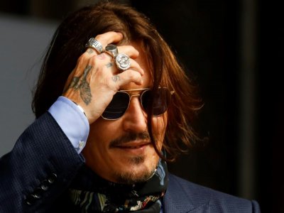 Johnny Depp devant le tribunal à Londres le 24 juillet où il poursuit le tabloïd le Sun - Tolga Akmen [AFP]