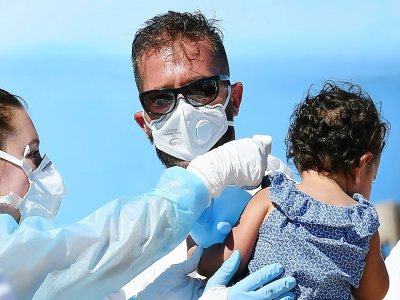 Arrivée de migrants secourus en Méditerranée au port de Lampedusa, le 29 juillet 2020 - Alberto PIZZOLI [AFP]