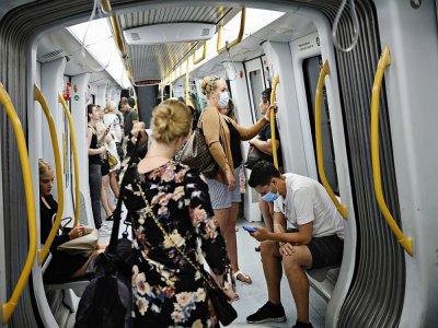 Des personnes portent un masque de protection dans le métro de Copenhague, le 15 août 2020 au Danemark - Philip Davali [Ritzau Scanpix/AFP]