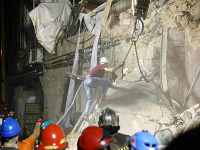 Des secouristes libanais assistés de chiliens cherchent parmi les ruines d'éventuels survivants le 4 septembre 2920 un mois après l'explosion - IBRAHIM  AMRO, IBRAHIM AMRO [AFP]