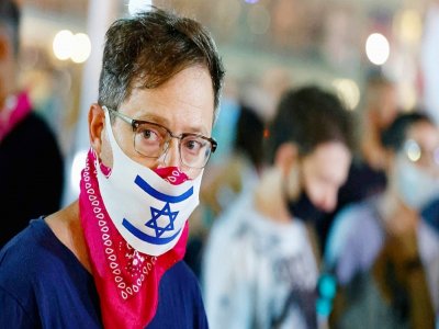 Un manifestant anti-confinement à Tel-Aviv le 17 septembre - JACK GUEZ [AFP]