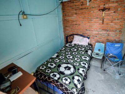 Le lit et la chambre de Hugo Lopez Camacho, un aide-soignant mort du Covid-19, le 24 mai 2020 à Mexico - PEDRO PARDO [AFP]