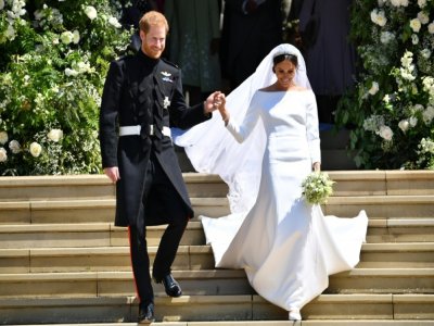 Le prince Harry et son épouse Meghan Markle lors de leur mariage, le 19 mai 2018 à Windsor - Ben STANSALL [AFP/Archives]