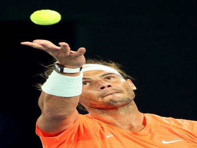 L'Espagnol Rafael Nadal, au service face au Britannique Cameron Norrie, lors du 3e tour de l'Open d'Australie, le 13 février 2021 à Melbourne - David Gray [AFP]