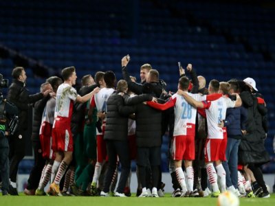 La joie des joueurs du Slavia Prague, vainqueurs des Glasgow Rangers (2-0) et qualifiés pour les quarts de finale de la Ligue Europa, le 18 mars 2021 à l'Ibrox Stadium à Glasgow - Andrew Milligan [POOL/AFP]