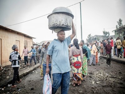 Des habitants de Goma, quittent la ville au lendemain de l'éruption du volcan Nyiragongo, le 23 mai 2021 en RDC - Guerchom Ndebo [AFP/Archives]