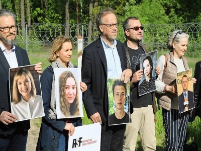 L'organisation Reporters sans frontières (RSF) a organisé une manifestation à la frontière entre la Lituanie et le Bélarus, en brandissant des portraits de 21 journalistes emprisonnés dans l'ancienne république soviétique située entre la Russie et l' - PETRAS MALUKAS [AFP]