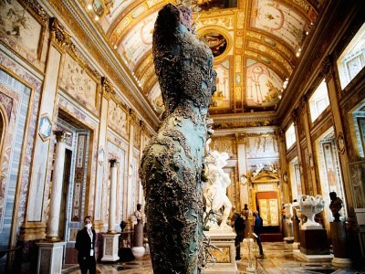 Hirst used traditional materials like bronze that almost blend in to the historic artworks around them - Tiziana FABI [AFP]