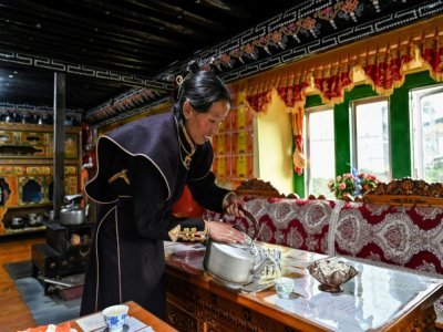 Cangjie a ouvert des chambres d'hôte, comme une cinquantaine de familles de Tashigang, le 4 juin 2021 - Hector RETAMAL [AFP]