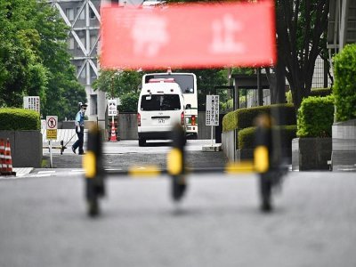 Un bus transportant Michael Taylor et son fils Peter arrive au tribunal de Tokyo, le 14 juin 2021 - Philip FONG [AFP/Archives]