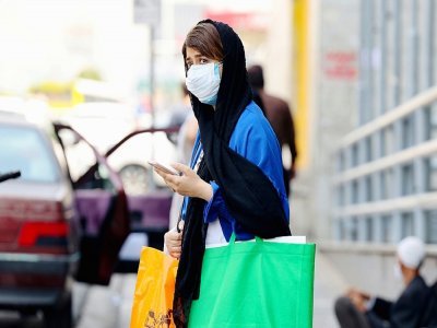 Une femme portant un masque dans les rues de Téhéran, le 3 juillet 2021 - ATTA KENARE [AFP]