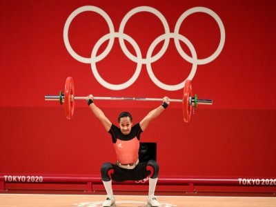 Loa Dika Toua de la Papouasie-Nouvelle-Guinée, lors de la compétition d'haltérophilie (49 kg), le 24 juillet 2021 aux Jeux Olympiques de Tokyo 2020 - Vincenzo PINTO [AFP]