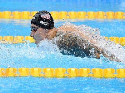 L'Américain Caeleb Dressel lors du 100 m papillon dans lequel il a été sacré champion olympique aux Jeux de Tokyo en signant un nouveau record du monde, le 31 juillet 2021 - Jonathan NACKSTRAND [AFP]