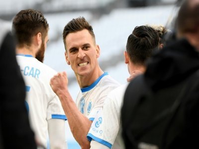 La joie de l'attaquant polonais de Marseille, Arkadiusz Milik, après avoir ouvert le score à domicile contre Brest, lors de leur match de Ligue 1, le 13 mars 2021 au Stade Vélodrome - NICOLAS TUCAT [AFP/Archives]