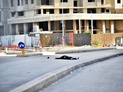 Un homme au sol dans les rues de Beyrouth, le 14 octobre 2021 au Liban - - [AFP]