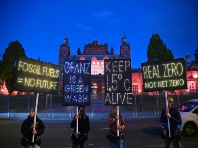 Des militants écologistes manifestent pendant la COP26, le 3 novembre 2021 à Glasgow, en Ecosse - Ben STANSALL [AFP/Archives]