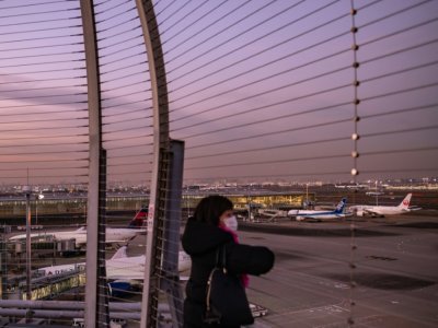 A l'aéroport international de Tokyo-Haneda le 29 novembre 2021 - Philip FONG [AFP]