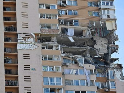 Un immeuble de Kiev touché par un missile, le 26 février 2022 - GENYA SAVILOV [AFP]