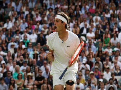 L'Américain Taylor Fritz contre Rafael Nadal en quart de finale de Wimbledon, le 6 juillet 2022 - Adrian DENNIS [AFP]