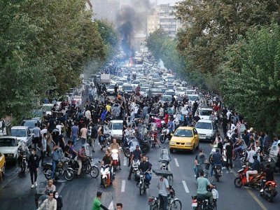 Une photo obtenue par l'AFP hors d'Iran montre une manifestation à Téhéran, le 21 septembre 2022 - - [AFP]